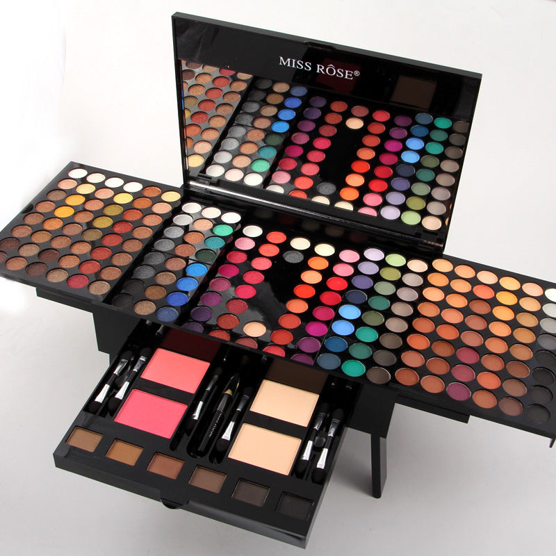 Eyeshadow and blush palette with applicator brush